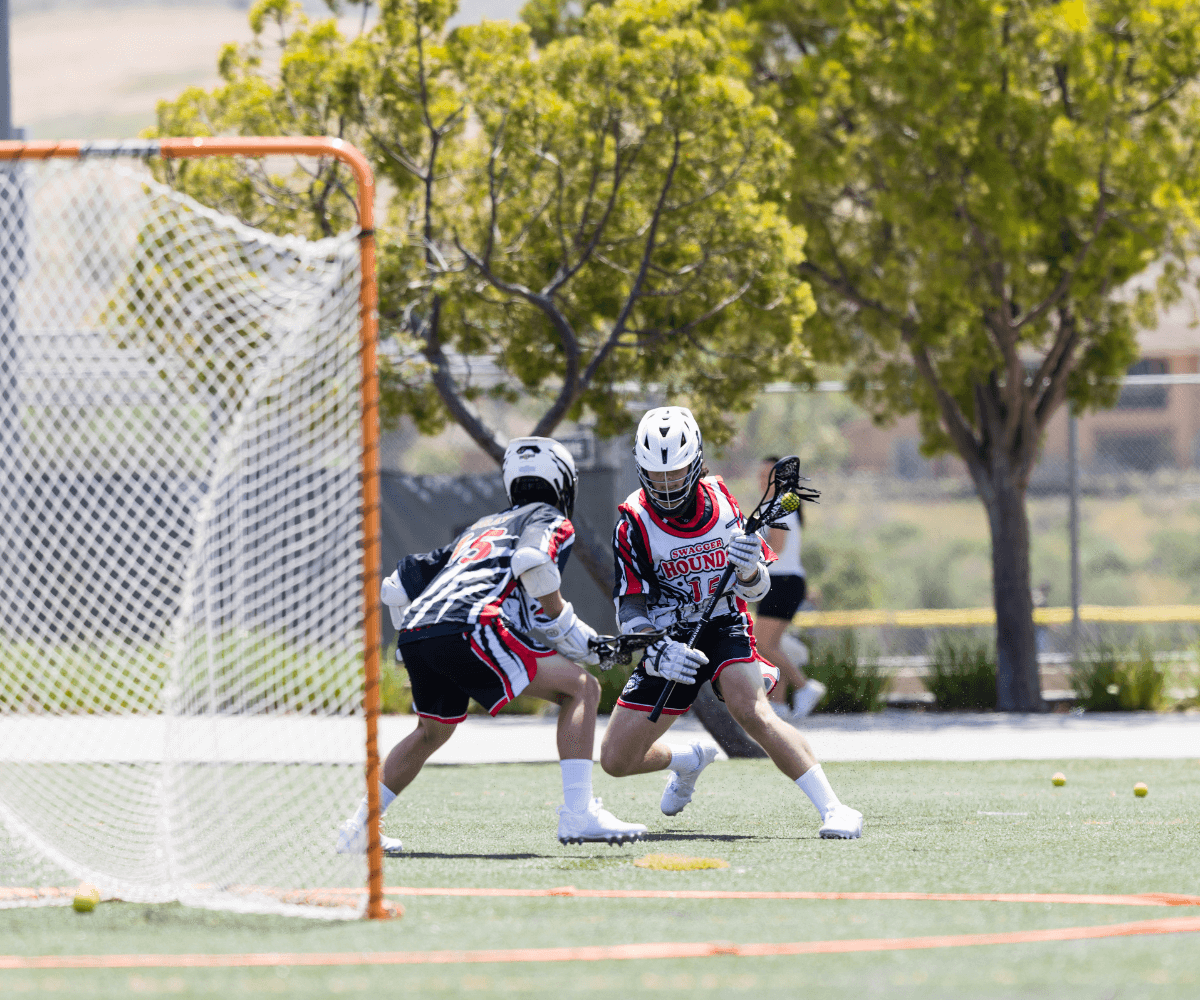Youth lacrosse players in action. Carolina Lacrosse Association is part of Signature Sports Brands.